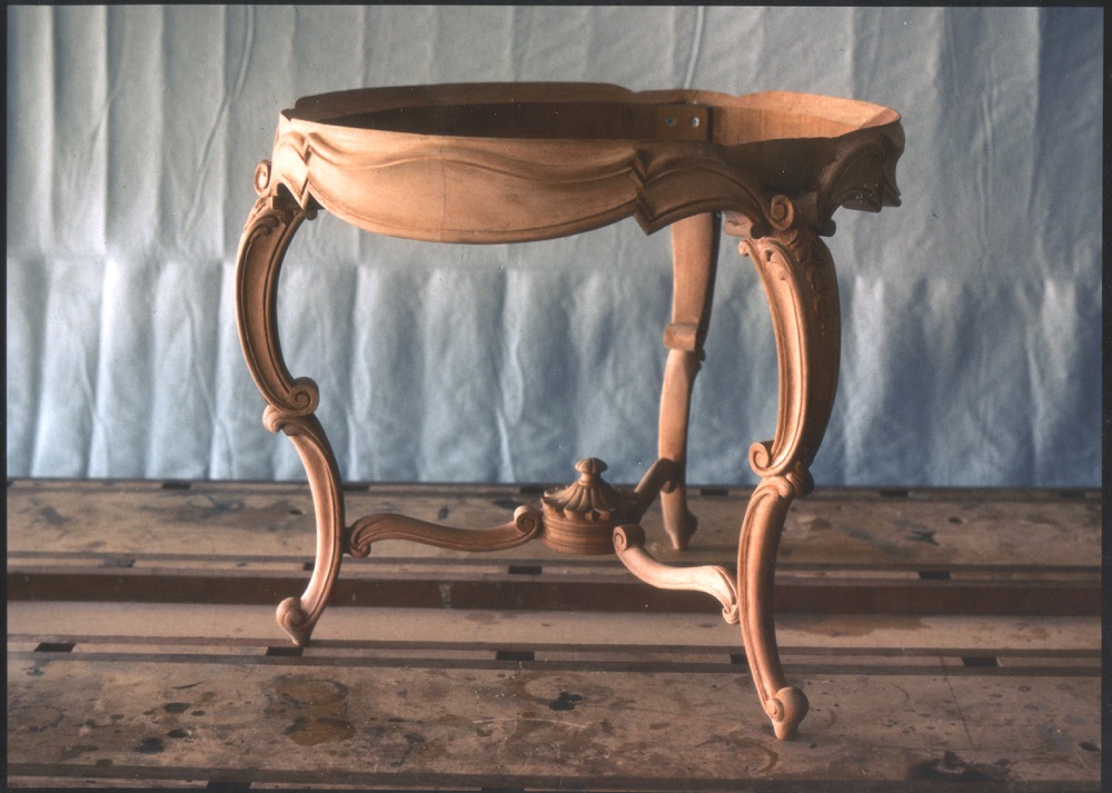 Traditional table commision. Carved wood